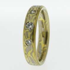 18k white and yellow gold mokume gane 5mm flat band with softened edge set with three brilliant cut diamonds<br/>