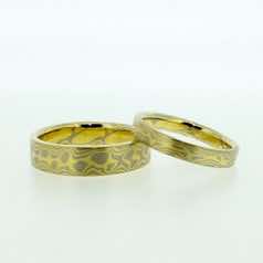 18k white and 18k yellow gold mokume gane flat bands.  Please go to online shop for prices.