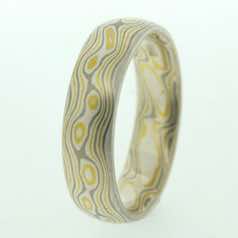 22k gold, 18k white gold and silver mokume gane full court band.  Please go to online shop for prices.