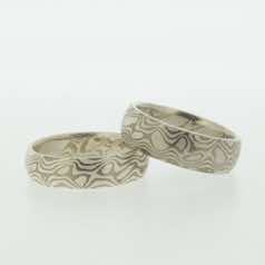 18k white gold and silver mokume gane full court bands.  Please go to online shop for prices.