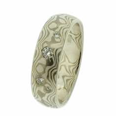 18k white gold and silver mokume gane 6mm full court band with four brilliant cut diamonds in a random scatter.<br/>
