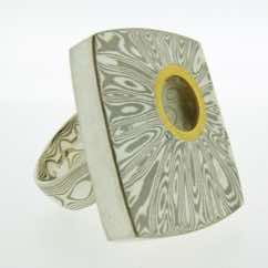 Terminus Ring in 18k white gold and silver with 22k gold and diamond details.  POA.