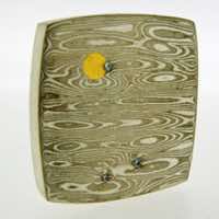 Transit patterned 18k white gold and silver mokume gane fower neukit brooch with 22k gold and diamond detail.