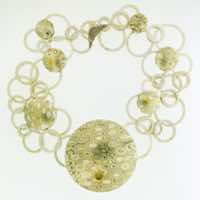 22k gold, 18k white gold and silver mokume gane 'Hairst' discus necklace with 22k gold and diamond details.  POA.