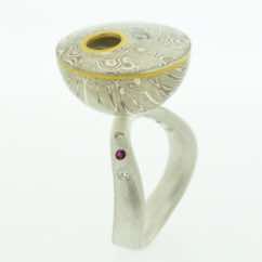 18k white gold and silver cup with 22k gold and diamond detail on sterling silver curved band with rubies and diamonds. 