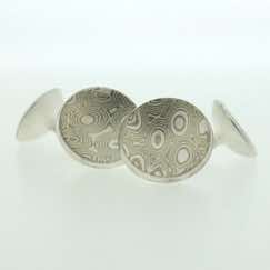 18k white gold and silver mokume gane concave round cufflinks with sterling silver rod and back.  