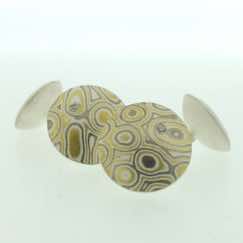 22k gold, 18k white gold and silver mokume gane discus cufflinks with diamonds.  Sterling silver rod and back.