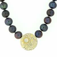 8mm peacock pearls with central discus in 22k gold, 18k white gold and silver mokume gane with 22k gold and diamond details.  POA.