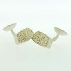 22k gold, 18k white gold and silver mokume gane fower neukit box cufflinks.  Sterling silver rod and back.