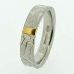 Textured 18k white gold 4mm flat band with 22k gold bar. POA