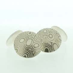 18k white gold and silver mokume gane discus cufflinks.  Sterling silver rod and back.