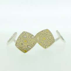 22k gold, 18k white gold and silver mokume gane fower neukit cufflinks with sterling silver rod and back.