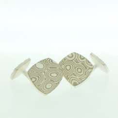 18k white gold and silver mokume gane fower neukit cufflinks with sterling silver rod and back.