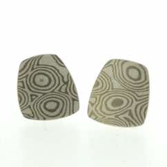18k white gold and silver mokume gane fower neukit stud earrings.