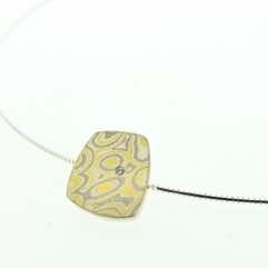 22k gold, 18k white gold and silver mokume gane small fower neukit pendant with flush set diamond.