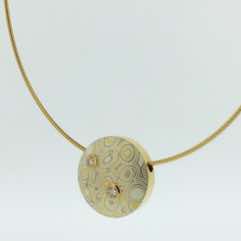 22k gold, 18k white gold and silver mokume gane discus pendant with brilliant cut diamonds set in 22k gold.  