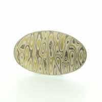 Transit patterned 22k gold, 18k white gold and silver mokume gane oval brooch diamond details. 