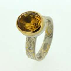 22k gold, 18k white gold and silver mokume gane flat band with flush set diamonds and a facet cut oval citrine in a 22k gold and silver rub-over pod setting. 