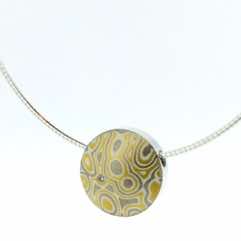 22k gold, 18k white gold and silver mokume gane small discus pendant with diamond detail.  