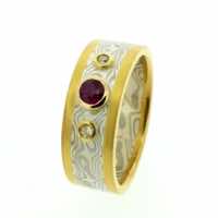 18k white gold and silver mokume gane flat band with contrasting yellow gold rails and ruby and diamonds set in low 22k gold rub-over settings