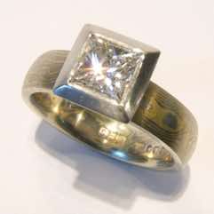 18k white and yellow gold mokume gane 4mm full court band with a princess cut diamond in an 18k white gold box setting