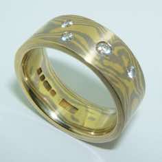 18k white and yellow gold mokume gane 7mm flat band with four brilliant cut diamonds in a random scatter<br/>