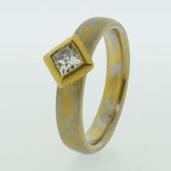 Platinum and 22k gold mokume gane full court band with a princess cut diamond in a 22k gold box setting