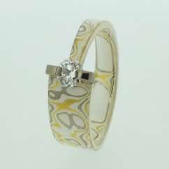 22k gold, 18k white gold and silver mokume gane tapered band with brilliant cut diamond in 18k white gold bar setting